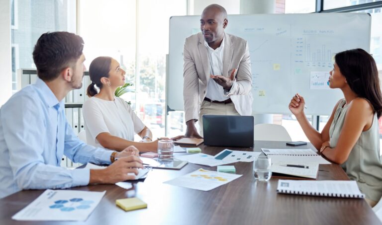 Businessman leadership speaking to employee for coaching, mentorship and economy planning in corpor